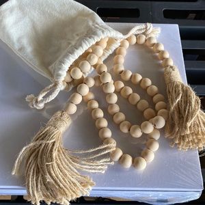 3 ft wooden bead with tassels on ends